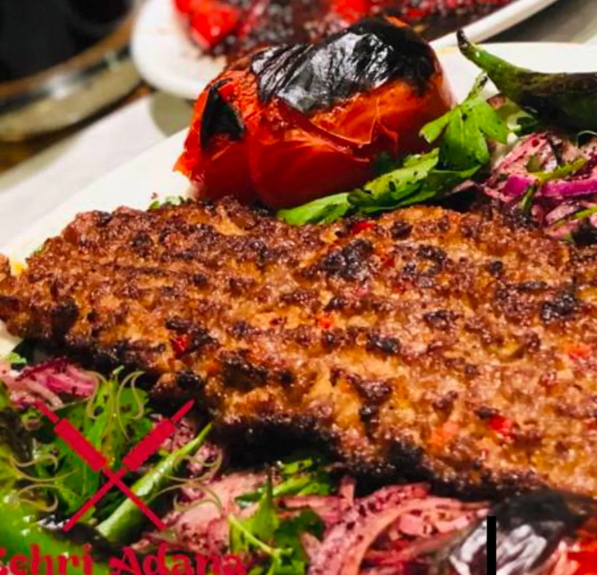 Beyti Kebap: Lavaş İçinde Sırlı Lezzet - Beyti kebabın sırrı: Adana usulü kıyma, lavaş ve tereyağlı domates sosun muhteşem uyumu. Antalya Lara'da Kebapçı Şeyhmuslara'da beyti kebabın en özel halini keşfedin! Beyti Kebap: Lavaş İçinde Sırlı Lezzet - Beyti kebabın sırrı: Adana usulü kıyma, lavaş ve tereyağlı domates sosun muhteşem uyumu. Antalya Lara'da Kebapçı Şeyhmuslara'da beyti kebabın en özel halini keşfedin!